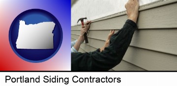 installing vinyl siding on a house in Portland, OR