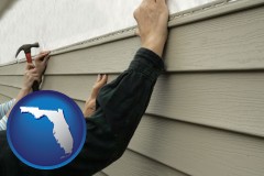 florida map icon and installing vinyl siding on a house