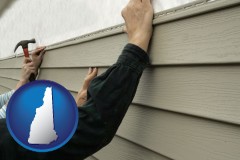 new-hampshire map icon and installing vinyl siding on a house