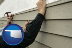 oklahoma map icon and installing vinyl siding on a house