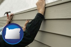 oregon map icon and installing vinyl siding on a house