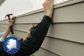 installing vinyl siding on a house - with Alaska icon