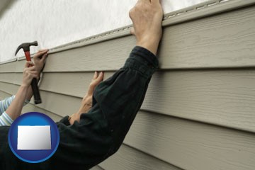 installing vinyl siding on a house - with Colorado icon