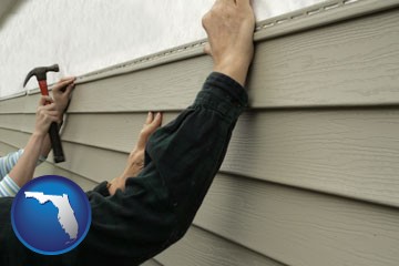installing vinyl siding on a house - with Florida icon