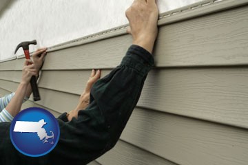 installing vinyl siding on a house - with Massachusetts icon