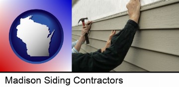 installing vinyl siding on a house in Madison, WI