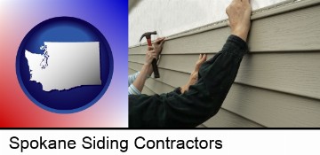 installing vinyl siding on a house in Spokane, WA